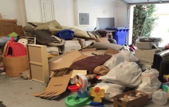 Garage and backyard excess junk removal.￼ - This removal was done from a backyard and garage full of garbage and old furniture. We had a few of our folks come and remove everything themselves. After the trailer was loaded our employees made sure with the client if that was all they needed and left.