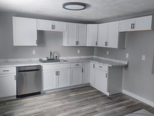 Kitchen remodel - The back half of the house was separating from the foundation, a new seal plate needed to be installed and new joists in the floor, subfloor was ripped out, wiring, plumbing were all replaced and a complete kitchen was built.