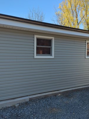 Full Exterior Upgrade - This project started with a home that had aging siding, ventilation concerns, and areas of water intrusion showing up both inside and out.
During our inspection, we identified issues with the existing exterior system, including worn siding, inefficient airflow, and areas that needed structural attention. The homeowner wanted a long-term solution, not just a patch.
We completed a full exterior upgrade that included new siding, soffit, fascia, gutters, and leaf protection to create a fully integrated system designed to protect the home and improve performance.
As part of the project, we:
Removed and replaced existing siding and materials
Installed new house wrap for moisture protection
Upgraded to Mastic Ovation vinyl siding
Replaced soffit, including the porch ceiling
Installed new fascia and seamless gutters with GutterRX covers
Closed off gable vents and addressed wall repairs for better efficiency
On the roofing side, we addressed underlying damage, replaced compromised decking, and installed a completely new shingle system with proper ventilation to prevent future moisture buildup.
The result is a home that not only looks completely refreshed, but is now protected from the top down with a system built to last. Full Exterior Upgrade - This project started with a home that had aging siding, ventilation concerns, and areas of water intrusion showing up both inside and out.
During our inspection, we identified issues with the existing exterior system, including worn siding, inefficient airflow, and areas that needed structural attention. The homeowner wanted a long-term solution, not just a patch.
We completed a full exterior upgrade that included new siding, soffit, fascia, gutters, and leaf protection to create a fully integrated system designed to protect the home and improve performance.
As part of the project, we:
Removed and replaced existing siding and materials
Installed new house wrap for moisture protection
Upgraded to Mastic Ovation vinyl siding
Replaced soffit, including the porch ceiling
Installed new fascia and seamless gutters with GutterRX covers
Closed off gable vents and addressed wall repairs for better efficiency
On the roofing side, we addressed underlying damage, replaced compromised decking, and installed a completely new shingle system with proper ventilation to prevent future moisture buildup.
The result is a home that not only looks completely refreshed, but is now protected from the top down with a system built to last.