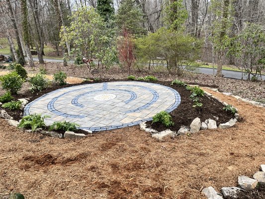 Mosaic in patio build - This patio was part of a larger landscape project and was created to be a relaxing area to sip a cup of tea in the private gardens.