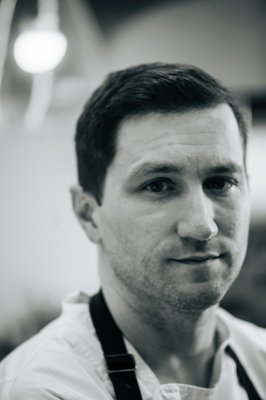 Meet Chef Spencer - Chef Spencer Conaty is renowned for his innovative approach to cuisine, focusing on seasonal, locally sourced ingredients. A graduate of Le Cordon Bleu Culinary School in Sacramento, Chef Spencer’s love for cooking started at a young age. Growing up in Placerville, CA, Chef Spencer was raised by his father who shared with him a love for food. After completing culinary school, Spencer was offered the opportunity to work under the chef he always idolized as a kid watching Iron Chef on TV, Chef Morimoto. After 4 years at Morimoto, Chef Spencer continued to refine and enhance his skills at the Michelin-starred Atelier Crenn in San Francisco, where he honed his skills under the tutelage of Chef Dominique Crenn. His time at Atelier Crenn instilled in him a deep appreciation for the artistry of food and a dedication to pushing the boundaries of culinary expression. Continuing to refine his craft, Chef Spencer joined the team at the three Michelin-starred Saison, where he further solidified his reputation for culinary innovation. At Saison, he embraced a philosophy of using locally sourced, seasonal ingredients to create refined and soulful dishes.
After gaining invaluable experience in the Bay Area, Chef Spencer felt a strong pull back to the Napa Valley. He spent the last several years honing his wine and food expertise as Chef for Silver Oak and Brian Arden and Sequoia Grove wineries. When Chef Spencer is not busy crafting enticing and artful dishes in the kitchen, Spencer enjoys tending his culinary garden and cherishing moments with his family, including his wife, son, Daughter, 3 dogs, and 6 goats.
Chef Spencer’s diverse experience with Michelin-starred cuisine, curated wine and food pairings, and event catering has shaped his unique approach to culinary innovation. His aim is to continue elevating the wine and food experiences at Five Senses, using his expertise to create pairings that are not only delicious but also enhance the unique terroir of the Napa Valley. Meet Chef Spencer - Chef Spencer Conaty is renowned for his innovative approach to cuisine, focusing on seasonal, locally sourced ingredients. A graduate of Le Cordon Bleu Culinary School in Sacramento, Chef Spencer’s love for cooking started at a young age. Growing up in Placerville, CA, Chef Spencer was raised by his father who shared with him a love for food. After completing culinary school, Spencer was offered the opportunity to work under the chef he always idolized as a kid watching Iron Chef on TV, Chef Morimoto. After 4 years at Morimoto, Chef Spencer continued to refine and enhance his skills at the Michelin-starred Atelier Crenn in San Francisco, where he honed his skills under the tutelage of Chef Dominique Crenn. His time at Atelier Crenn instilled in him a deep appreciation for the artistry of food and a dedication to pushing the boundaries of culinary expression. Continuing to refine his craft, Chef Spencer joined the team at the three Michelin-starred Saison, where he further solidified his reputation for culinary innovation. At Saison, he embraced a philosophy of using locally sourced, seasonal ingredients to create refined and soulful dishes.
After gaining invaluable experience in the Bay Area, Chef Spencer felt a strong pull back to the Napa Valley. He spent the last several years honing his wine and food expertise as Chef for Silver Oak and Brian Arden and Sequoia Grove wineries. When Chef Spencer is not busy crafting enticing and artful dishes in the kitchen, Spencer enjoys tending his culinary garden and cherishing moments with his family, including his wife, son, Daughter, 3 dogs, and 6 goats.
Chef Spencer’s diverse experience with Michelin-starred cuisine, curated wine and food pairings, and event catering has shaped his unique approach to culinary innovation. His aim is to continue elevating the wine and food experiences at Five Senses, using his expertise to create pairings that are not only delicious but also enhance the unique terroir of the Napa Valley.