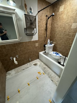 Bathroom remodel - Remodel of bathroom with floor and wall tile installed. Bathroom remodel - Remodel of bathroom with floor and wall tile installed.