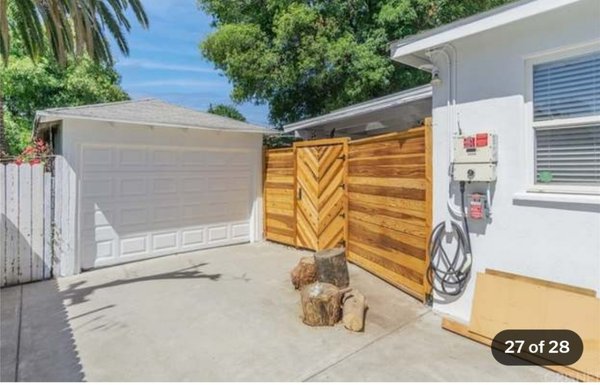 Wooden privacy fence - Wooden privacy fence with mosaic door detail. Wooden privacy fence - Wooden privacy fence with mosaic door detail.