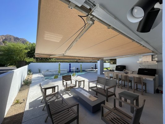 Awnings - This western-facing patio in Palm Desert had taken a beating from the harsh sun, making the space nearly unusable. After discussing options with the customer, he chose to install an awning, and it's been a fantastic addition! The awning has significantly reduced heat both inside the home and on the patio, making it comfortable again. Plus, the lights on the arms provide excellent illumination at night, allowing for continued outdoor enjoyment. Thank you for choosing Screenmobile!