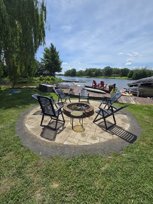 Interlocking Job with lake view - An interlocking job at a lake view involved installing a series of interlocking pavers to create a neat and durable patio.
The process included:
Planning and Design: The team planned the layout, considering the natural scenery and ensuring the patio complemented the lake view.
Excavation: They dug out the area where the interlocking bricks would be placed, ensuring a level surface.
Base Preparation: A layer of gravel was spread and compacted to form a stable base.
Laying the Bricks: The interlocking bricks were carefully arranged in the desired pattern, fitting together snugly.
Finishing Touches: Sand was brushed into the gaps between the bricks to lock them in place, and the edges were secured to prevent shifting.
The result was a beautiful, functional outdoor space that enhanced the lake view, perfect for enjoying the scenery. Interlocking Job with lake view - An interlocking job at a lake view involved installing a series of interlocking pavers to create a neat and durable patio.
The process included:
Planning and Design: The team planned the layout, considering the natural scenery and ensuring the patio complemented the lake view.
Excavation: They dug out the area where the interlocking bricks would be placed, ensuring a level surface.
Base Preparation: A layer of gravel was spread and compacted to form a stable base.
Laying the Bricks: The interlocking bricks were carefully arranged in the desired pattern, fitting together snugly.
Finishing Touches: Sand was brushed into the gaps between the bricks to lock them in place, and the edges were secured to prevent shifting.
The result was a beautiful, functional outdoor space that enhanced the lake view, perfect for enjoying the scenery.