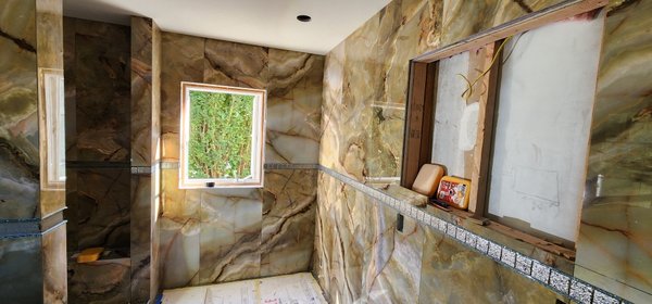 bathroom remodeling 2024 - this bathroom remodeling is done in 2 weeks with demolition , builds a new wood frame , installs cementboard, and installs tile.