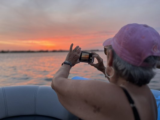 Sunset Tours AMI - An evening with a private boat is a great way to catch an incredible AMI sunset! Bring your favorite drinks!

An evening on your own private boat cruise is a perfect way to unwind and enjoy the stunning colors of the sky as the sun sets over the water. The tranquil atmosphere of the water and the peaceful breeze create a relaxing and romantic ambiance. It's a memorable way to celebrate a special occasion or just enjoy a peaceful evening with loved ones.