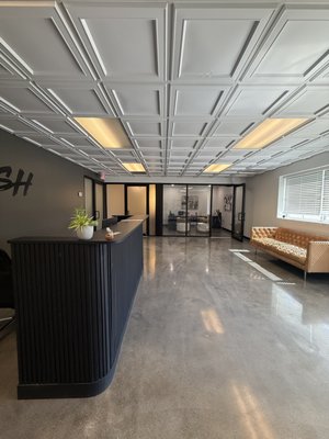 Office Remodel - The owners of a growing business purchased an outdated commercial space previously used for a sewing and embroidery shop. The existing layout was non-compliant with current codes and didn’t match their vision for a sleek, industrial-modern office environment.
We started with detailed measurements and full architectural design, then executed a complete transformation:
Demo’d LVP flooring, non-structural walls, outdated ceilings, and old plumbing.
Reconfigured the interior layout for better flow, creating two private owner offices (one in the front lobby and one overlooking the shop area).
Installed a welcoming showroom-style lobby with accent walls for future branding.
Polished and stained the concrete floors (after grinding, leveling, and epoxy crack repair) for a stunning industrial finish.
Built a fully ADA-accessible bathroom featuring a modern floating sink and privacy glass
Upgraded electrical, plumbing, and all systems to bring the space fully up to code.
Replaced the ceiling with updated ACT panels and added sophisticated lighting.
The result is a professional, open, and functional industrial-modern workspace perfectly tailored to the client’s needs.
Ready to transform your commercial space? Contact Evolve Design and Build today! Office Remodel - The owners of a growing business purchased an outdated commercial space previously used for a sewing and embroidery shop. The existing layout was non-compliant with current codes and didn’t match their vision for a sleek, industrial-modern office environment.
We started with detailed measurements and full architectural design, then executed a complete transformation:
Demo’d LVP flooring, non-structural walls, outdated ceilings, and old plumbing.
Reconfigured the interior layout for better flow, creating two private owner offices (one in the front lobby and one overlooking the shop area).
Installed a welcoming showroom-style lobby with accent walls for future branding.
Polished and stained the concrete floors (after grinding, leveling, and epoxy crack repair) for a stunning industrial finish.
Built a fully ADA-accessible bathroom featuring a modern floating sink and privacy glass
Upgraded electrical, plumbing, and all systems to bring the space fully up to code.
Replaced the ceiling with updated ACT panels and added sophisticated lighting.
The result is a professional, open, and functional industrial-modern workspace perfectly tailored to the client’s needs.
Ready to transform your commercial space? Contact Evolve Design and Build today!