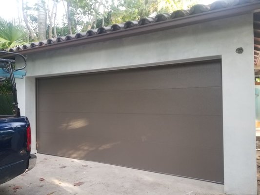 installing a new garage door - this is a complete hurricane rated garagedoor with motor wood fram up to county code