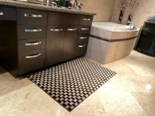 Bathroom Vanity Rug - The client wanted a rug for their bathroom vanity. They liked this rug but this was an 8x10 rug and they did not have enough time to order a custom rug. So, we cut an 8x10 rug to fit their bathroom vanity area. They were all happy satisfied.