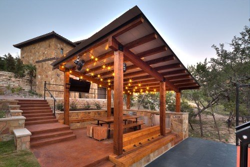 Hill Country Terrace Court and Landscape - Cedar Frame Kitchen Cabana With Dining Area, Seating, String lights, Mounted TV, Charcoal Park Style Grill. Limestone Retainer Wall & Sport Court With Stadium Seating. Sandstone Fence Columns, Vineyard, Rose Planters. Oklahoma Patio veneer steps and Limestone Slab Walls. Hill Country Terrace Court and Landscape - Cedar Frame Kitchen Cabana With Dining Area, Seating, String lights, Mounted TV, Charcoal Park Style Grill. Limestone Retainer Wall & Sport Court With Stadium Seating. Sandstone Fence Columns, Vineyard, Rose Planters. Oklahoma Patio veneer steps and Limestone Slab Walls.
