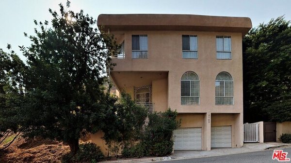 I sold Hollywood home - minutes from the heart of Hollywood but at the same time tucked away from everyday life deep in Hollywood Hills. Small staircase leads you from the street level to a double door entry of grand hall with marble floors that beautifully transition into custom made hardwood flooring. Passing by the elevator and entry from the garage is the spacious kitchen with open floor plan. Vaulted ceilings with recessed lights bring plenty of light. Contemporary Italian/Canadian kitchen with custom cabinets and natural stone counter top, kitchen nook and separate dining area. All updated appliances: sub-zero refrigerator, softener & water cleaner. Smooth transition from kitchen and dining into living room makes exceptionally warm and inviting area. Custom marble fireplace adds the cherry on top of this floor and will make you want to spend most of your time here entertaining your guests. Bedroom on this floor has its own entry from the side of the house and can be used as office, maid's or babysitter's room. 2nd floor includes 3 bedrooms. Master bedroom is very spacious with plenty of closet space. Master bathroom offers Jacuzzi and steam room inside the shower. Patio is tucked away for maximum privacy with free standing Jacuzzi, barbecue grill and sun auto-cover. From patio and also by the elevator you have access to the fla I sold Hollywood home - minutes from the heart of Hollywood but at the same time tucked away from everyday life deep in Hollywood Hills. Small staircase leads you from the street level to a double door entry of grand hall with marble floors that beautifully transition into custom made hardwood flooring. Passing by the elevator and entry from the garage is the spacious kitchen with open floor plan. Vaulted ceilings with recessed lights bring plenty of light. Contemporary Italian/Canadian kitchen with custom cabinets and natural stone counter top, kitchen nook and separate dining area. All updated appliances: sub-zero refrigerator, softener & water cleaner. Smooth transition from kitchen and dining into living room makes exceptionally warm and inviting area. Custom marble fireplace adds the cherry on top of this floor and will make you want to spend most of your time here entertaining your guests. Bedroom on this floor has its own entry from the side of the house and can be used as office, maid's or babysitter's room. 2nd floor includes 3 bedrooms. Master bedroom is very spacious with plenty of closet space. Master bathroom offers Jacuzzi and steam room inside the shower. Patio is tucked away for maximum privacy with free standing Jacuzzi, barbecue grill and sun auto-cover. From patio and also by the elevator you have access to the fla