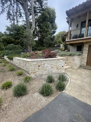 Carmel Stone Retaining Walls and Plantscaping - This new home landcape construction consisted of carmel stone, plants and pavers with drip irrigation Carmel Stone Retaining Walls and Plantscaping - This new home landcape construction consisted of carmel stone, plants and pavers with drip irrigation
