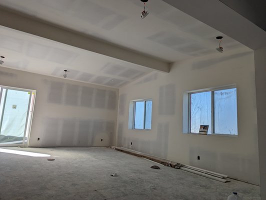 Room addition Tape and finish Level 4 - This was a living room conversion/ addition. Drywall was already installed and we provided a high quality smooth finish. We taped all joints and angles, then applied three coats of compound on all joints and screws. We made sure dust was kept to a minimum while the project was being worked on. Final sand to a smooth finish, clean up and debris removal. Room addition Tape and finish Level 4 - This was a living room conversion/ addition. Drywall was already installed and we provided a high quality smooth finish. We taped all joints and angles, then applied three coats of compound on all joints and screws. We made sure dust was kept to a minimum while the project was being worked on. Final sand to a smooth finish, clean up and debris removal.