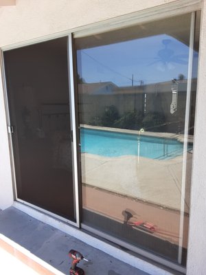 Sliding Screen Door Re-Screen - Our Sliding Screen door service includes lubricating and adjusting the moving parts,
and resceening the door with our top quality fiberglass patio screen mesh. Sliding Screen Door Re-Screen - Our Sliding Screen door service includes lubricating and adjusting the moving parts,
and resceening the door with our top quality fiberglass patio screen mesh.