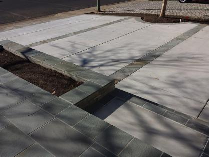 Professional Driveway Design - We perform driveway services of all kinds. Not level? Starting to crack? Give us a call we'll help with it all. Stop by our showroom to see all the various materials we can incorporate in your new driveway.