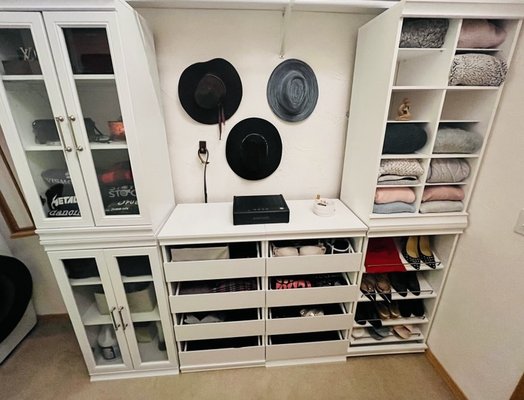 Judit L-Organizing Wizard - This client was looking to be done with hanging clothes and build a closet system that looks cleaner and has spaces for folded clothes.
We picked out drawers and shelves from Wayfair ($1200), had our handyman remove the existing cabinet and rods + build the new system ($400). We also stacked the dryer on washer to make room for her existing makeup table.
Then the client went through her clothes and decided to donate 5 bags of clothing before Judit went in and found a place for all her remaining clothes (3 hours, $200 total). There's still shelves left for new clothes and left side of the closet has room to add on another shelving system if needed or it has a rod for hanging things if needed.