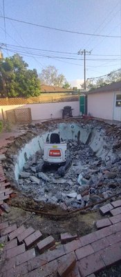Culver City Pool Demo - This customer’s yard was being completed held up by an old pool that wasn’t being used. By backfilling her pool and removing her brick decking, we were able to provide her with a fully usable yard where she can garden and entertain guests. Culver City Pool Demo - This customer’s yard was being completed held up by an old pool that wasn’t being used. By backfilling her pool and removing her brick decking, we were able to provide her with a fully usable yard where she can garden and entertain guests.