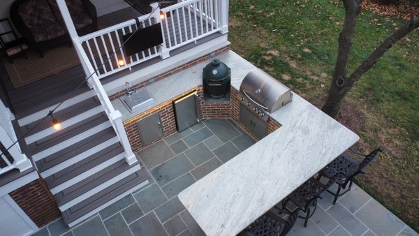The Backyard Bistro - We designed and built a custom outdoor kitchen paired with a beautiful flagstone patio, creating a seamless space for cooking, dining, and relaxing outdoors. This project turned an unused area into a functional and elegant backyard centerpiece. The Backyard Bistro - We designed and built a custom outdoor kitchen paired with a beautiful flagstone patio, creating a seamless space for cooking, dining, and relaxing outdoors. This project turned an unused area into a functional and elegant backyard centerpiece.