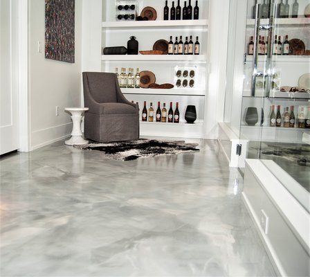 Residential Epoxy Floor - If you’re looking to upgrade your home’s concrete floors, epoxy flooring offers the perfect mix of durability, low maintenance, and eye-catching style. Whether it’s your garage, basement, patio, or even your kitchen, residential epoxy floors provide a long-lasting solution that looks great and holds up under the daily wear and tear of life.
Here’s why homeowners love epoxy floors:
Durable and Resilient: Epoxy floors can withstand heavy foot traffic, moisture, and even spills, making them ideal for high-traffic areas in the home.
Easy to Maintain: A seamless surface means dirt and grime can’t hide in cracks. Regular cleaning is a breeze, with little more than a mop and some water needed to keep your floors looking pristine.
Customizable Finishes: Whether you want a sleek, modern solid color or something more decorative like metallic or flake finishes, our epoxy floors come in a variety of styles to suit your personal taste.
Moisture Resistant: Epoxy floors create a waterproof barrier, making them perfect for areas like basements or bathrooms that are prone to moisture and humidity.
Allergen-Free: Unlike carpet or wood floors, epoxy doesn’t trap dust, pet dander, or allergens, making it a great option for homeowners looking to maintain a cleaner, healthier living environment. Residential Epoxy Floor - If you’re looking to upgrade your home’s concrete floors, epoxy flooring offers the perfect mix of durability, low maintenance, and eye-catching style. Whether it’s your garage, basement, patio, or even your kitchen, residential epoxy floors provide a long-lasting solution that looks great and holds up under the daily wear and tear of life.
Here’s why homeowners love epoxy floors:
Durable and Resilient: Epoxy floors can withstand heavy foot traffic, moisture, and even spills, making them ideal for high-traffic areas in the home.
Easy to Maintain: A seamless surface means dirt and grime can’t hide in cracks. Regular cleaning is a breeze, with little more than a mop and some water needed to keep your floors looking pristine.
Customizable Finishes: Whether you want a sleek, modern solid color or something more decorative like metallic or flake finishes, our epoxy floors come in a variety of styles to suit your personal taste.
Moisture Resistant: Epoxy floors create a waterproof barrier, making them perfect for areas like basements or bathrooms that are prone to moisture and humidity.
Allergen-Free: Unlike carpet or wood floors, epoxy doesn’t trap dust, pet dander, or allergens, making it a great option for homeowners looking to maintain a cleaner, healthier living environment.