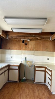 Kitchen Water Damage Repair in Tustin - A leak from the master bathroom upstairs caused water damage in the kitchen ceiling and possibly in the hallway ceiling. Upon inspection, moisture readings showed elevated levels, and stains on the kitchen ceiling suggested possible mold growth. The affected materials included drywall, upper cabinets, and possibly insulation. This was categorized as a Category 3, Class 2 loss.

The recommended approach was to remove all affected materials and conduct clearance testing afterward. During the demolition, it was confirmed that the source of the leak was a faulty toilet base seal in the master bathroom, leading to water damage in the kitchen ceiling below. An air scrubber was used under negative air pressure during the demolition, and IAQ and antimicrobial solutions were applied to wipe down the framing.

A nail was also found in a PVC pipe, which will require attention from a plumber, expected to arrive by Wednesday. Once the plumbing work is completed, the team will return to finish the prep work, including sealing wall cavities and final cleaning. Afterward, a mold clearance test was scheduled and passed successfully. All equipment was removed, and the homeowner now needs to sign the certificate of completion to move forward with repairs.