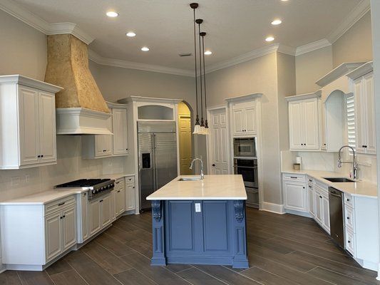 Kitchen cabinets 2022 - This was a kitchen refresh. The owners wanted white cabinets with a dark blue island.
