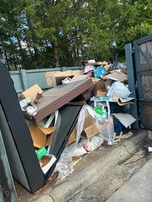 Apartment Enclosure Clean Up - We helped an apartment complex get rid of all overflow trash while they waited for their dumpster to be delivered.