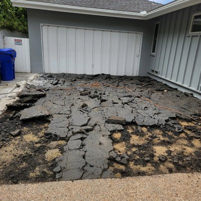 Driveway project - This driveway was asphalt. We demo'd the asphalt, graded it, added rebar and poured beautiful colored concrete with special tooling. Driveway project - This driveway was asphalt. We demo'd the asphalt, graded it, added rebar and poured beautiful colored concrete with special tooling.