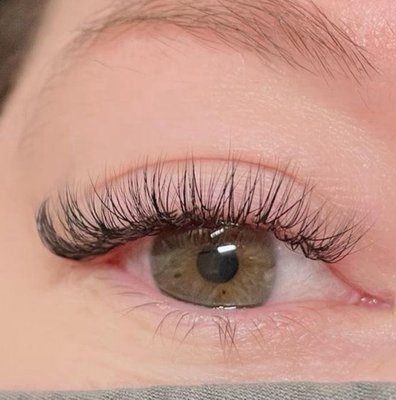 Hybrid - hybrid lashes blend 1:1 extensions with volume-style fans for a denser, textured appearance, combining elements of both classic and volume lashes. Hybrid - hybrid lashes blend 1:1 extensions with volume-style fans for a denser, textured appearance, combining elements of both classic and volume lashes.