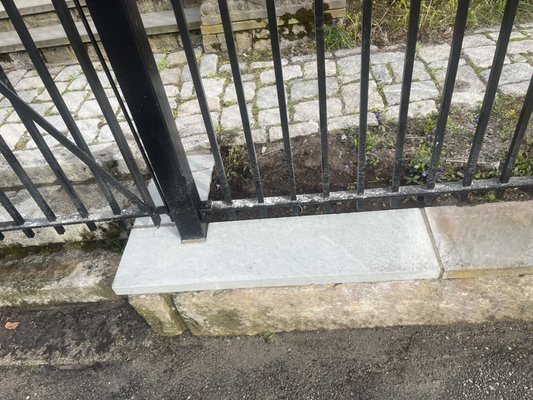 Replace bluestones treading underneath metal fence in Provincetown cape cod mass - This repair job was done in ptown cape cod mass previous stones was cracked and old so we repair the surface and put new ones in Replace bluestones treading underneath metal fence in Provincetown cape cod mass - This repair job was done in ptown cape cod mass previous stones was cracked and old so we repair the surface and put new ones in