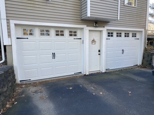 Greenland, NH - 2 Colonial Style 9’x7’ garage doors with decorative hinges and handles. Replaced old chain drive openers with new Chamberlain Belt Drive Openers. Greenland, NH - 2 Colonial Style 9’x7’ garage doors with decorative hinges and handles. Replaced old chain drive openers with new Chamberlain Belt Drive Openers.