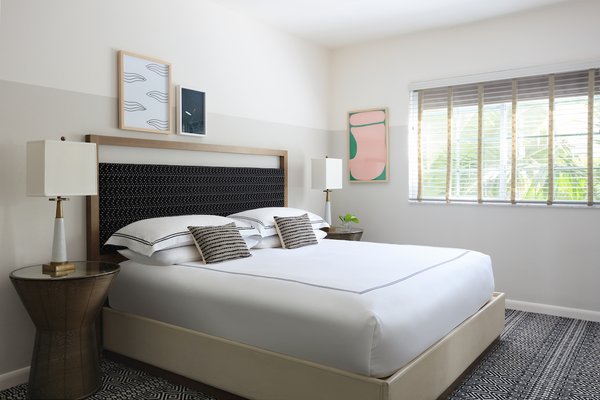 Dreamy Miami Boutique Hotel - After a day of sampling South Beach delights —mojitos, coladas and outdoor shopping, anyone? — there's no prettier place to put your feet up. Surfcomber has revamped every guestroom and suite in a palette of provencal neutrals, muted tropical tones and black-and-white patterns that pay homage to South Beach’s glam Art Deco history. Pamper yourself with Atelier Bloem bath products, then dream away on our sumptuous pillow-top bed wrapped in cool, crisp linens. Even the guestroom corridors are a sight to behold.
Our Specialty Guestrooms and Suites go the extra step of providing your own personal green space. Catch a breeze on a private balcony or veranda, bedecked with evergreen turf, while taking in water or city views. Dreamy Miami Boutique Hotel - After a day of sampling South Beach delights —mojitos, coladas and outdoor shopping, anyone? — there's no prettier place to put your feet up. Surfcomber has revamped every guestroom and suite in a palette of provencal neutrals, muted tropical tones and black-and-white patterns that pay homage to South Beach’s glam Art Deco history. Pamper yourself with Atelier Bloem bath products, then dream away on our sumptuous pillow-top bed wrapped in cool, crisp linens. Even the guestroom corridors are a sight to behold.
Our Specialty Guestrooms and Suites go the extra step of providing your own personal green space. Catch a breeze on a private balcony or veranda, bedecked with evergreen turf, while taking in water or city views.