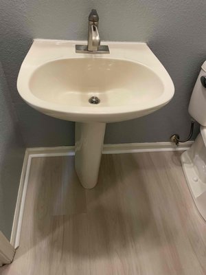 Bathroom Remodel - This bathroom had new flooring installed. The toilet and pedestal sink were installed over the new flooring. Bathroom Remodel - This bathroom had new flooring installed. The toilet and pedestal sink were installed over the new flooring.
