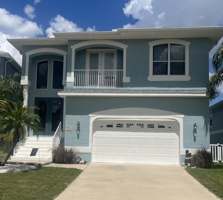 New Listing - Live the Florida lifestyle in this newer home built in 2005 with direct access to the open Gulf. Bring all the water toys with a 12x18 dock, 16,000 lb boat lift, jet ski dock and kayak launch area. This 3 bedroom, 3 bathroom, oversized garage/workshop, pool home, complete with a large bonus room is a must see. The home has 3,052 sq ft of living area with vaulted ceilings and an open floor plan. Beautiful Brazilian oak flooring spans the main dining, kitchen and spacious living room areas. Triple 8 feet disappearing sliders open fully to the screened balcony with scenic waterfront views. The home is a dream for entertaining with granite bar tops surrounding the open kitchen’s fine wood cabinetry and ambiance lighting. The master suite is a private retreat, offering stunning waterfront views through a triple set of windows, a spacious walk in closet and direct access to the laundry room. The en-suite bathroom has a double vanity, large soaking tub and walk in shower. The split floor plan provides privacy, with the second and third bedrooms on the opposite side of home. Large great room downstairs has a built in bar and makes a perfect area for a mother in law suite, game or media room. The first floor leads directly out to the pool surrounded by pavers and large covered area for shade. The first floor is insurable with current flood insurance $837 yearly. Home sits at 14 feet elevation. There is 60 feet of water frontage. The oversized garage fits 3+ vehicles and has a workshop area. Home was built with space for an elevator. Recent updates include new roof 2023, newer AC 3 yrs old, and remodeled bedrooms. Meticulously maintained home. Resort style amenities with a clubhouse, pool, jacuzzi, sauna, boat ramp, and tennis/pickleball courts and exclusive membership to a private beach. Low HOA fees. A tremendous 1st class value!