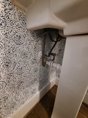 Wallpapering powder room - Installation wallpaper in the powder room. The sink does not have vanity, so wallpaper have installed under sink as well. Wallpapering powder room - Installation wallpaper in the powder room. The sink does not have vanity, so wallpaper have installed under sink as well.