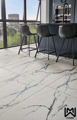 Savoy Azula Porcelain Tile - Savoy Azula Porcelain Tile features a bright white  background with bold gray veining throughout. These tiles can be used to create breathtaking backsplashes, accent walls, entryways, flooring, and more i residential spaces. savoy Azula offers the desired look of marble with the durability,  low maintenance, and affordability of porcelain. The tiles are available in matte and polished finishes and 12" X 24" and 24" X 48" sizes offering design flexibility.