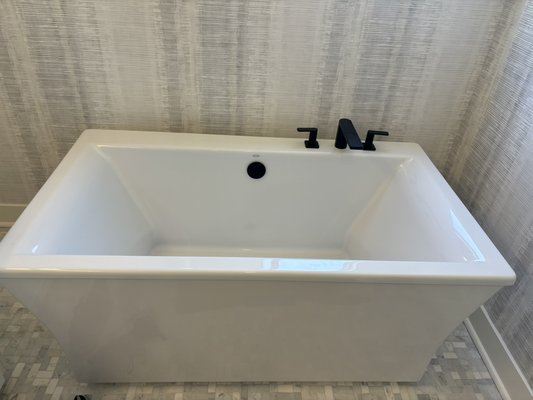 Bathtub Reinstallation & Plumbing Upgrade - Reinstalled a bathtub, replacing the existing waste and overflow assembly with a new ABS P-trap for improved drainage. Installed a new tub faucet by soldering ½" copper supply lines and connecting them to the existing PEX hot and cold water lines using reliable ball valves for long-term durability and shut-off control. Bathtub Reinstallation & Plumbing Upgrade - Reinstalled a bathtub, replacing the existing waste and overflow assembly with a new ABS P-trap for improved drainage. Installed a new tub faucet by soldering ½" copper supply lines and connecting them to the existing PEX hot and cold water lines using reliable ball valves for long-term durability and shut-off control.