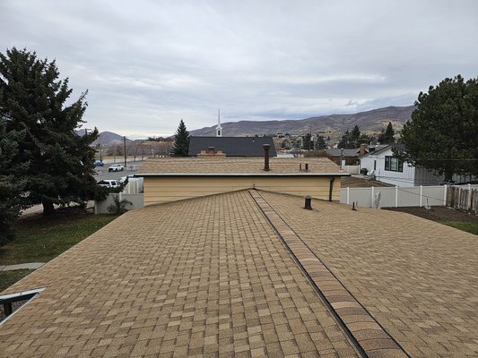 Heber City roofing replacement - This is a full ashpalt shingle roof replacement in Heber City, Utah.  We removed all of the old material, cut in ridge vents on both ridges.  We installed a 40-year architectural shingle.  This turned out beautiful and we gave our customers a fantastic price!  Keep in mind we complete all of the roofing work in-house with our own crew, and you have a guarantee from a local company that you can count on!