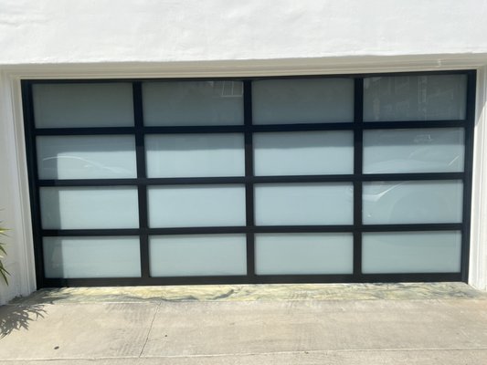 Custom Wayne Dalton Garage Door Model 8800 Full View Garage Door - Installation of a single car garage and a double car garage of Wayne Dalton Garage model 8800 black anodized on White laminated glass Custom Wayne Dalton Garage Door Model 8800 Full View Garage Door - Installation of a single car garage and a double car garage of Wayne Dalton Garage model 8800 black anodized on White laminated glass