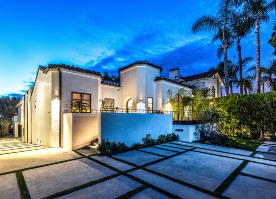 Contemporary Spanish Revival - This was a complete remodel of an old Spanish style home. The family wanted a large indoor/outdoor living area for entertaining family and friends. They also wanted everything to be on one level including the pool. The lot is on a down slope and the pool was engineered to be built into the deck and suspended above the down sloped lot.