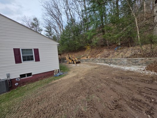 Retaining wall - This wall had damage from a tree and poor drainage and was repaired and reinstalled the correct way Retaining wall - This wall had damage from a tree and poor drainage and was repaired and reinstalled the correct way