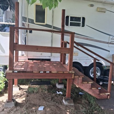 Mobile home entry deck - Built entry deck to mobile home with reinforcement concrete posts.