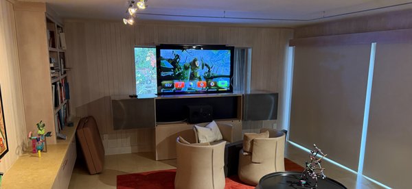 15 Year old TV update - The Client wanted to upgrade his existing TV, once on site and with some time we decided to modify the existing cabinet in a way that allowed the client to see out his window while more than doubling his screen size at the same time.