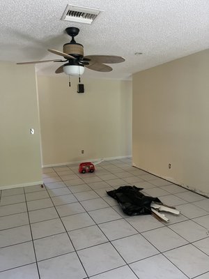 New Vinyl Flooring Installation w/ New baseboards. - Client was moving in and wanted to feel at home with all new flooring with baseboards and even a whole house paint.
