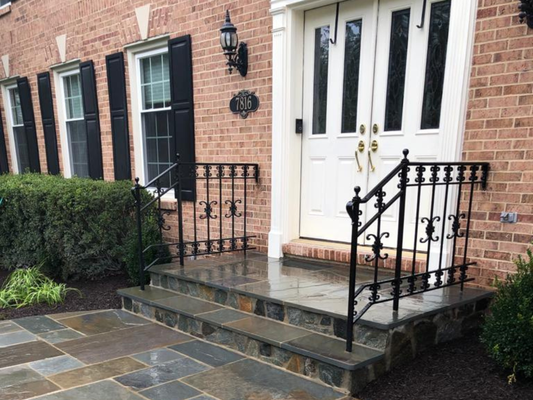 Front Entrance Stone Walkway & Steps Installatio - Stunning front entrance upgrade for a residential client, featuring a custom stone walkway and matching steps. Using a blend of gray, brown, and blue-toned rectangular pavers, we created a natural, random pattern that adds both elegance and durability. The steps were built with the same premium stone and bordered with sleek black wrought iron railings for safety and style.

🌿 Surrounding landscaping was refreshed to complement the new hardscape, including trimmed shrubs, ornamental grasses, and a clean lawn finish. The result? A welcoming, low-maintenance entryway that enhances the home's overall aesthetic and functionality.

✅ Professional. ✅ Timely. ✅ Built to last.