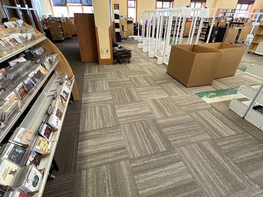 Commercial Carpet Tile Replacement - We provided a full removal and replacement of carpet tile for the Wilkinson Public Library in Telluride. Our team worked in tandem with two different crews, one removing books and shelves and another installing new shelves after we placed new carpet. The project was delivered ahead of schedule working with a tight deadline. The library remained open for the duration of work. Commercial Carpet Tile Replacement - We provided a full removal and replacement of carpet tile for the Wilkinson Public Library in Telluride. Our team worked in tandem with two different crews, one removing books and shelves and another installing new shelves after we placed new carpet. The project was delivered ahead of schedule working with a tight deadline. The library remained open for the duration of work.