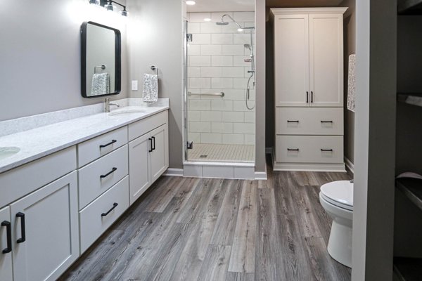 All White Bathroom with Black Hardware and Gray Flooring - Senior Designer, Michelle Bortolotto created this inviting bright and airy all-white bathroom. The accent of the black mirrors and hardware achieves a balance in the design that will never go out of style. All White Bathroom with Black Hardware and Gray Flooring - Senior Designer, Michelle Bortolotto created this inviting bright and airy all-white bathroom. The accent of the black mirrors and hardware achieves a balance in the design that will never go out of style.