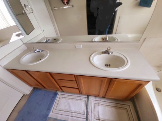 Countertop and faucet replacement - Customers had severely rusted sinks, out dated faucets and out dated countertop
