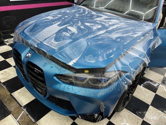 BMW M4 Matte PPF Application - Brand new matte blue BMW M4 came to the shop to protect its delicate matte paint finish. Our matte PPF installation covered the full front end of this gorgeous car: bumper, hood, fenders, mirrors and headlights to protect it from rick chips and scratches. Matte PPF applied over matte paint will not change the look of the car at all, you cannot see! All cars need some protection but with matte paint,  once it gets a ding, you most likely need to repaint 3-5 panels adjacent to the damage or the paint will not match! PPF will not only protect it but if it gets damaged we simply replace that piece, saving you lots of money! Protect your brand new cars with clear bra paint protection film!