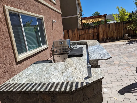 Stone & Granite BBQ Countertops –  530‑318‑0504 - Fire up your outdoor living dreams with Mason’s Granite Shop! Our Stone Projects & Granite BBQ Countertops portfolio highlights custom‑built granite BBQ islands, outdoor kitchen countertops, and patio bars that stand up to tough Gardnerville/Lake Tahoe weather while adding resort‑style elegance to your backyard. We fabricate and install heat‑, stain‑, and freeze‑resistant granite in a spectrum of colors and finishes, design seamless cut‑outs for grills and sinks, and create polished or chiseled edge profiles that show off true craftsmanship. Whether you’re planning a full outdoor kitchen, a sleek grilling station, or a durable prep counter for poolside parties, our team delivers precise measurements, expert stone cutting, and flawless installation—on time and on budget.